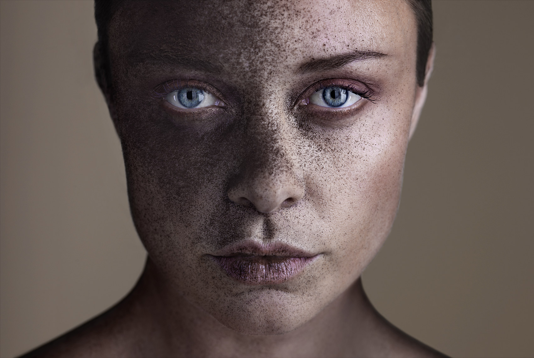 Fashion model with brown powder on her face